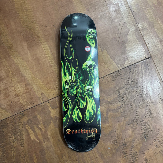 green skulls and flames on black skateboard deck
