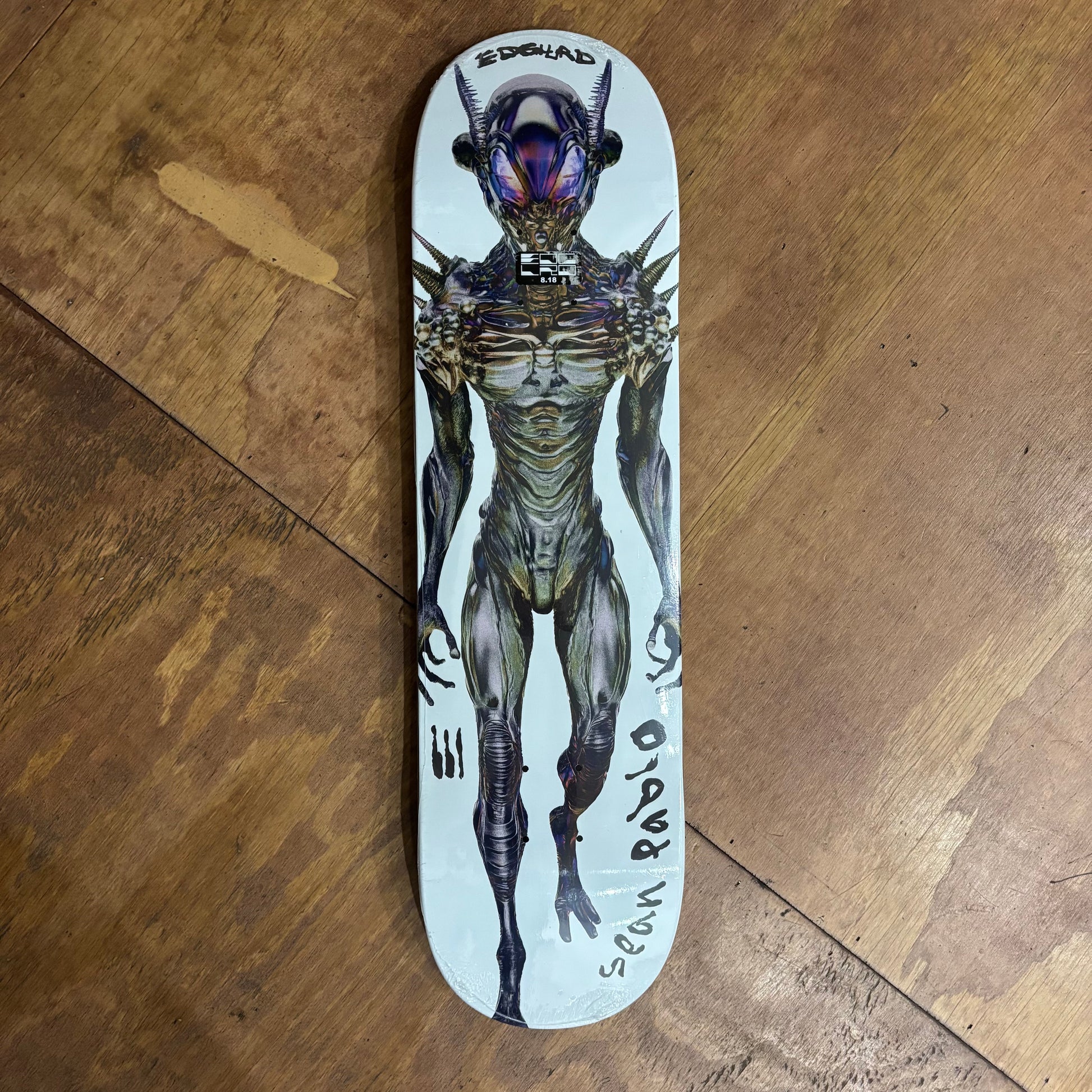 alien sci fi character on white background skateboard deck