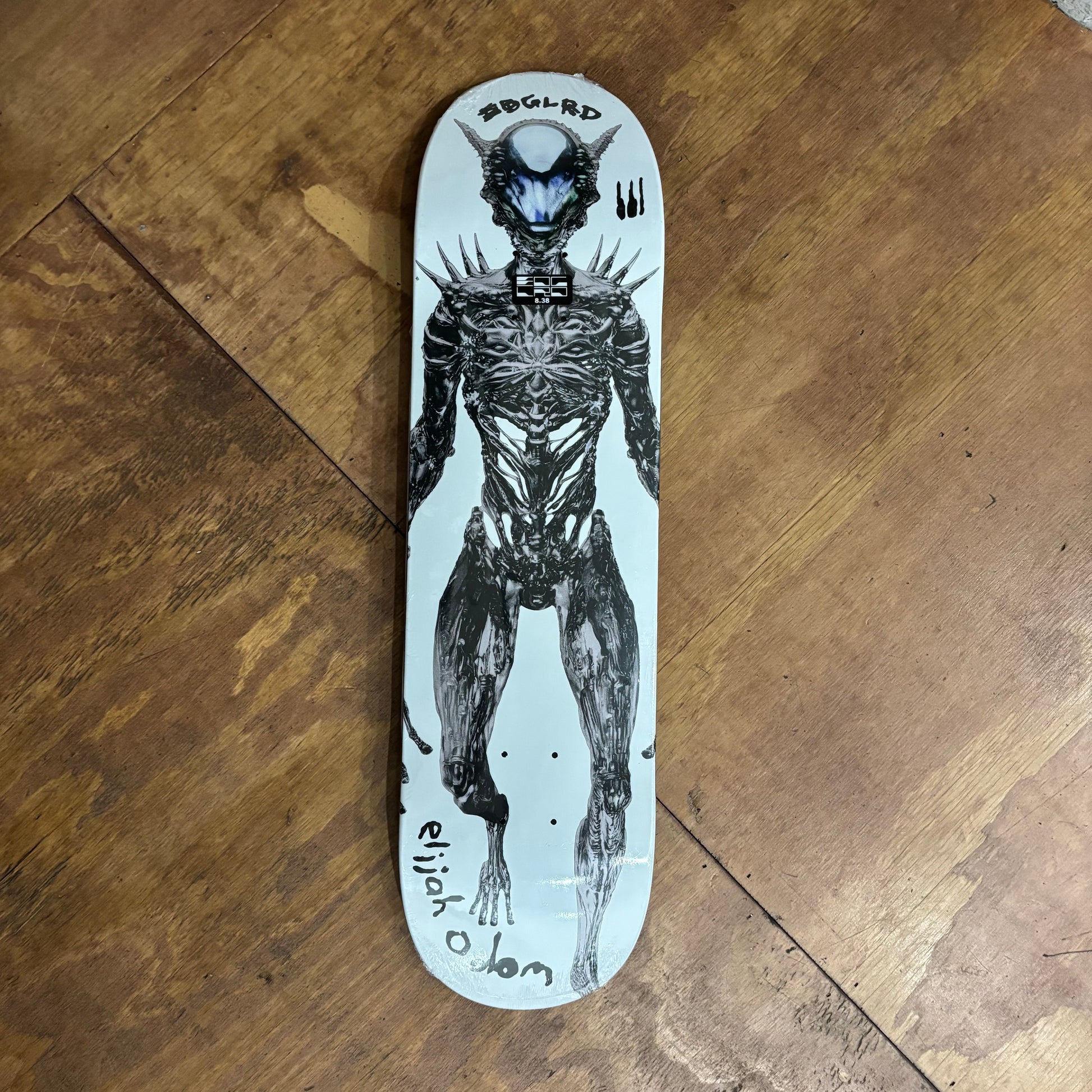 alien sci fi character on white background skateboard deck