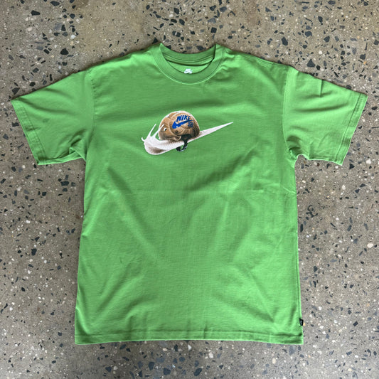 green t-shirt with a snail in the shape of the nike logo in the center 