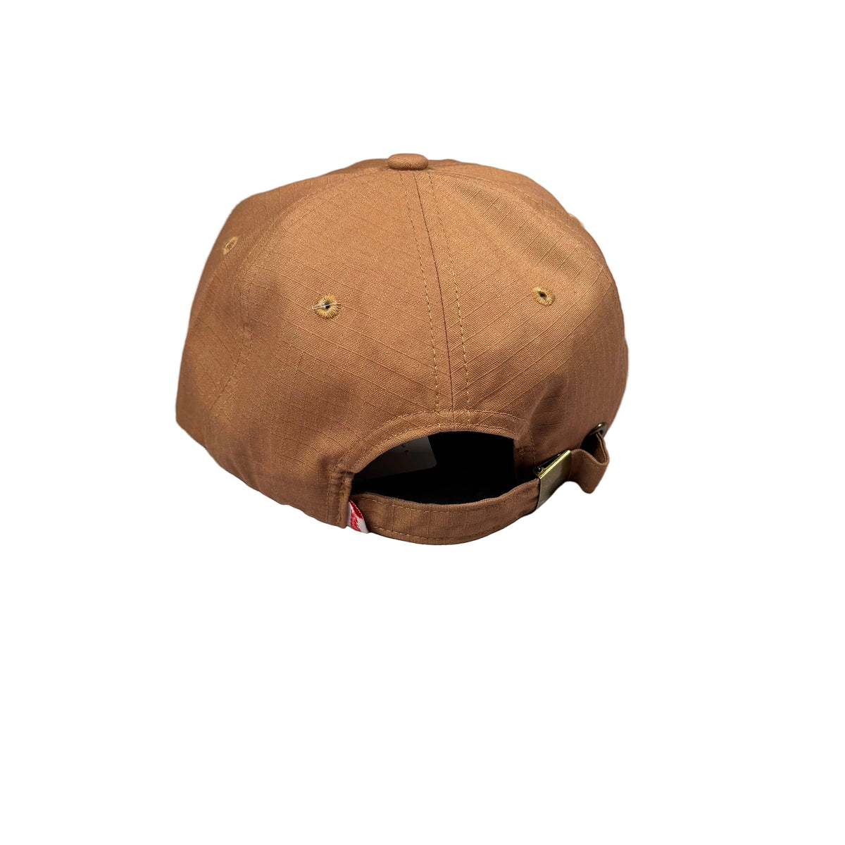 A brown baseball cap viewed from the back, resting on a white surface.