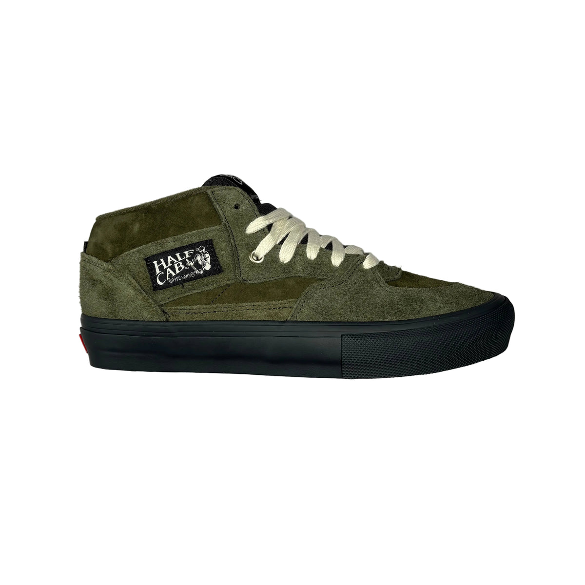 An olive green suede and canvas mid-top skate shoe with off-white laces and a black rubber sole, shown from a side profile on a white background. A 'Half Cab' brand patch is visible on the side.