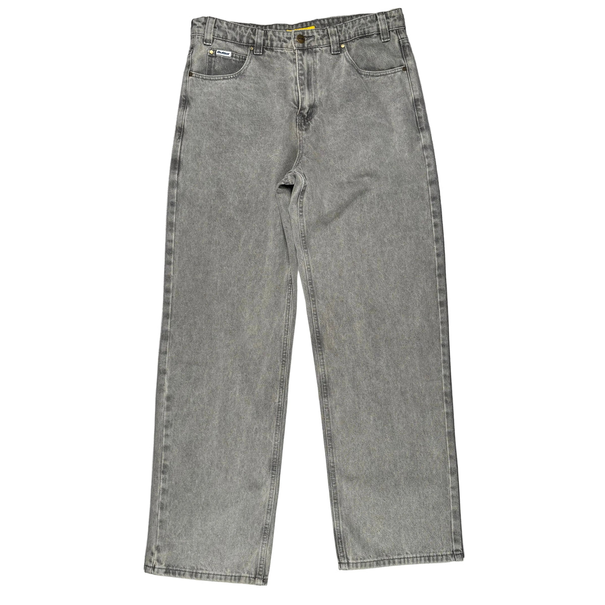 A pair of faded gray denim jeans laid flat on a white surface.