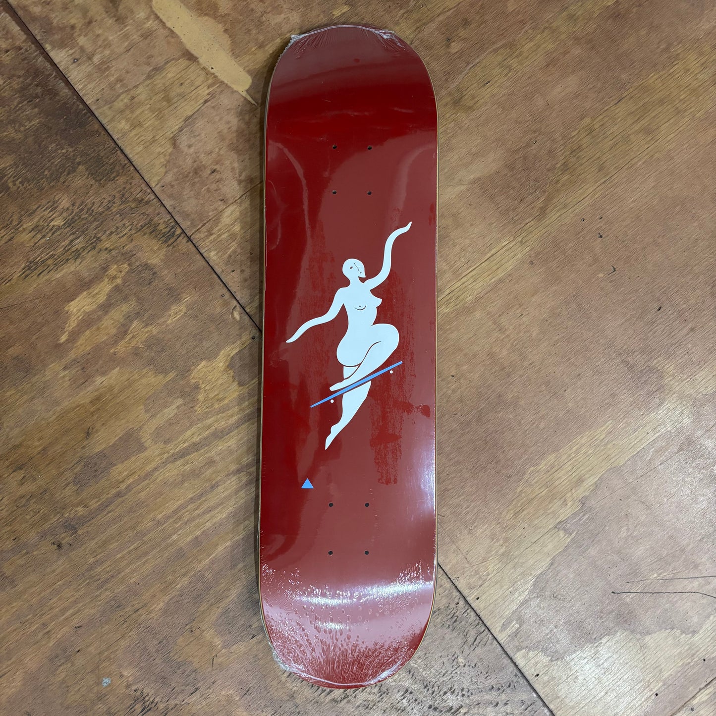 red background deck with tasteful nude doing a no comply