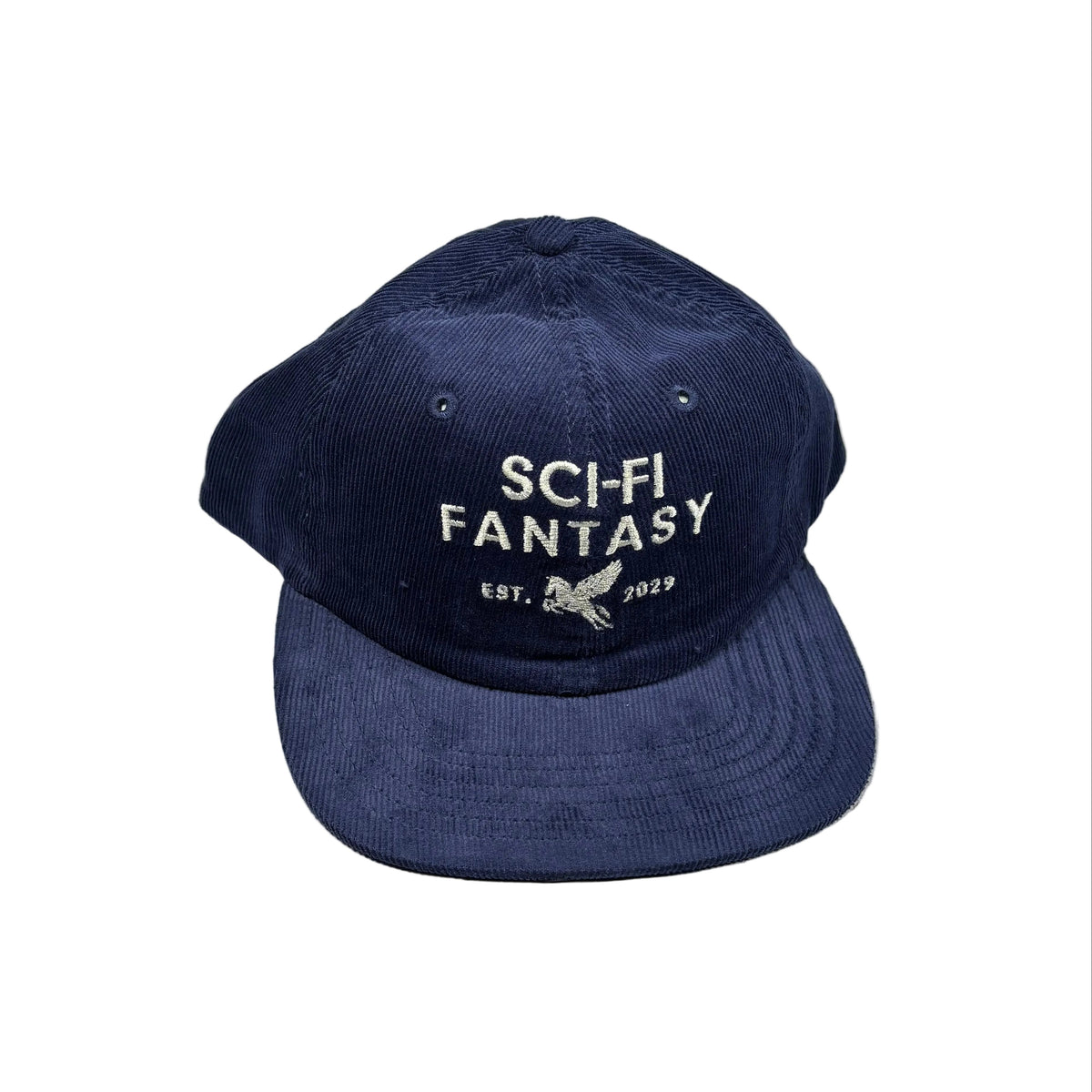 A navy blue corduroy baseball cap with 'SCI-FI FANTASY' embroidered in white on the front, resting on a white surface
