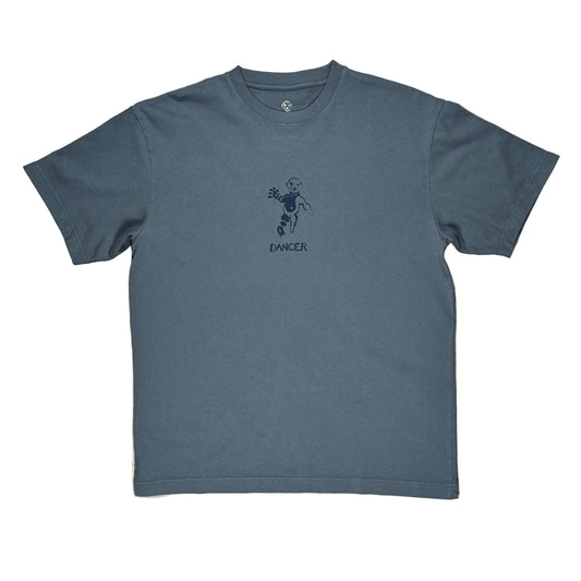 A slate blue short-sleeve t-shirt with a dark blue graphic of a dancing figure and the word 'DANCER' printed on the chest, laid flat on a white background