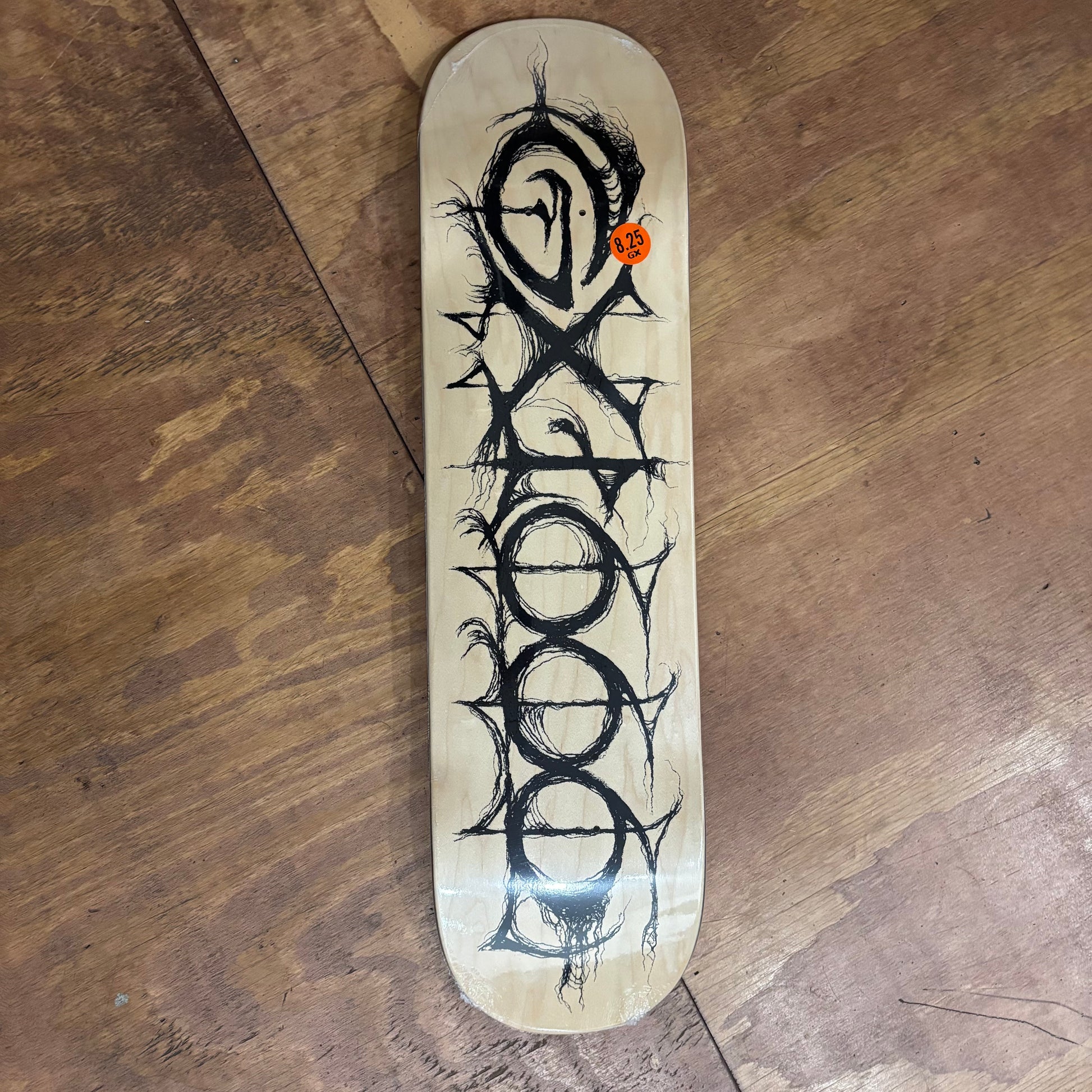 hand drawn GX1000 logo on woodgrain deck
