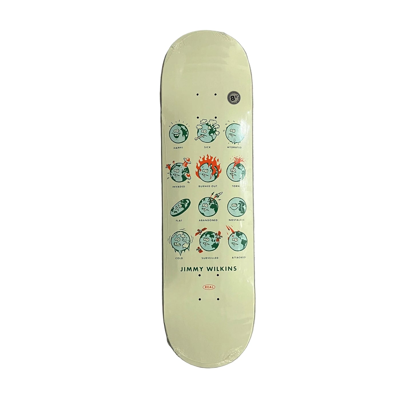 A vintage-style skateboard deck with a pale yellow-green background and a graphic of circular faces in green, red, and black, with 'JIMMY WILKINS' printed at the bottom, photographed flat on a white surface.