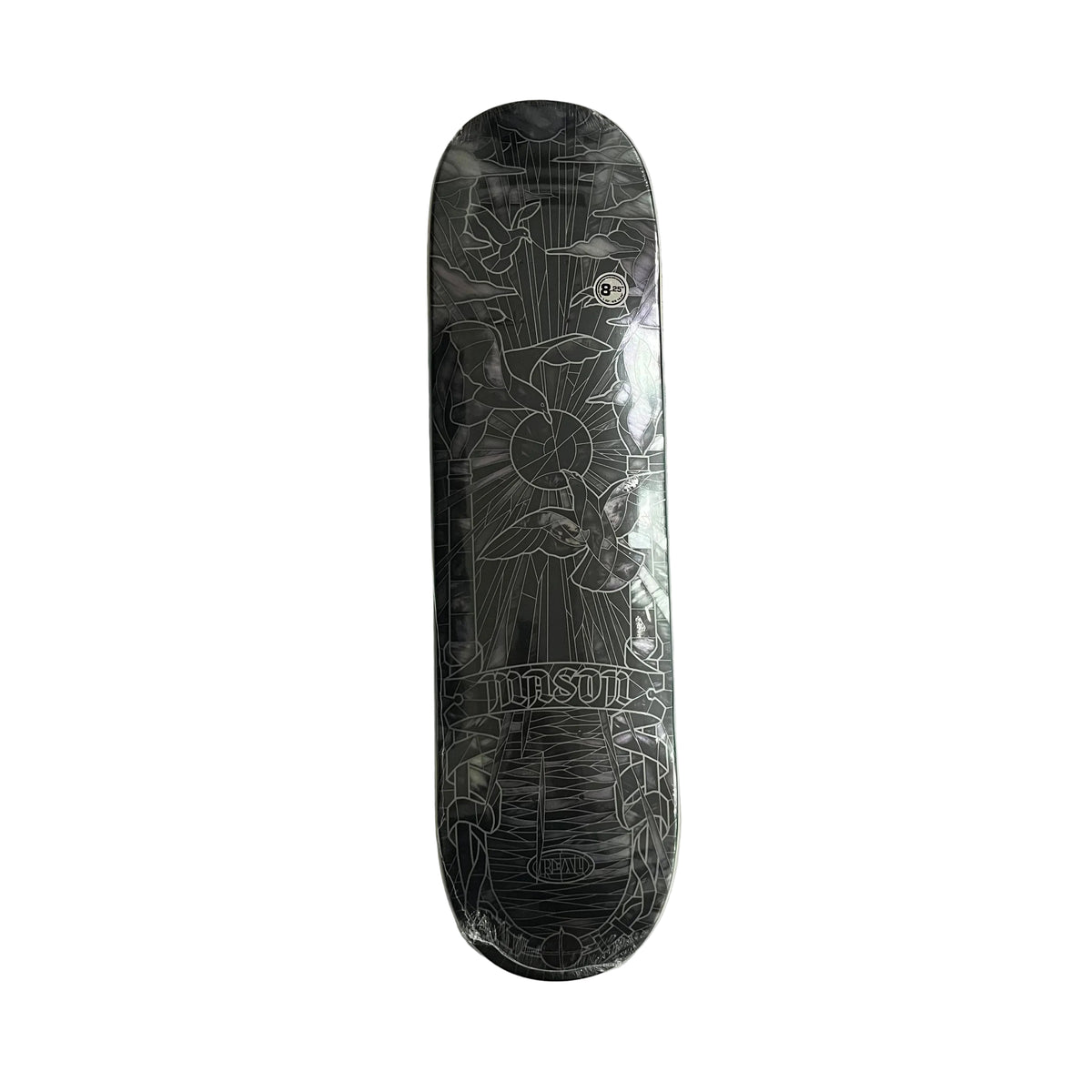 A Real skateboard deck in clear protective plastic wrap, featuring a detailed black and gray line art design of a birds and sunburst, photographed flat on a white background.