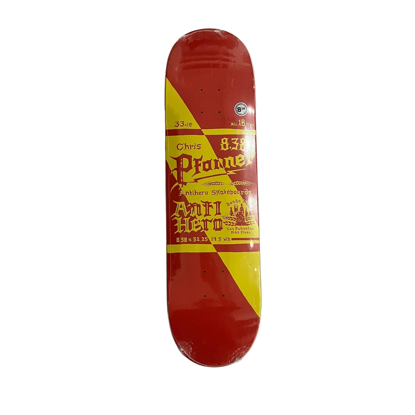 A red and yellow skateboard deck labeled 'Chris Pfanner with Anti Hero' resting on a white surface.
