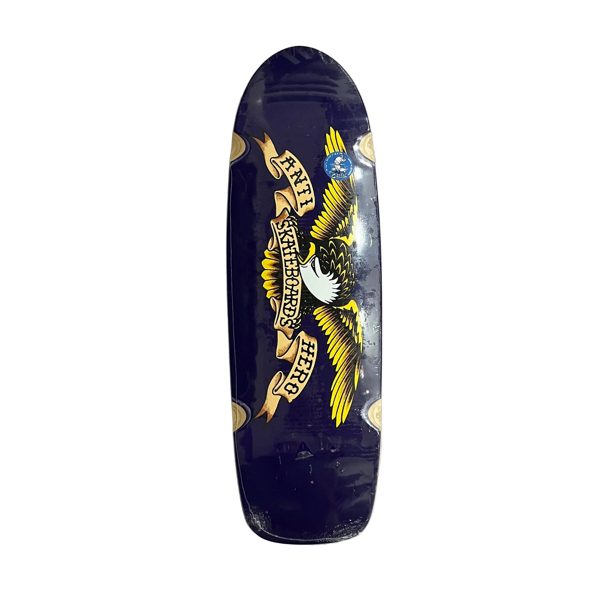 A dark navy blue skateboard deck with a large graphic of an eagle holding a banner that reads 'ANTI HERO SKATEBOARDS' in yellow, white, and black. The deck is photographed from above on a white surface.