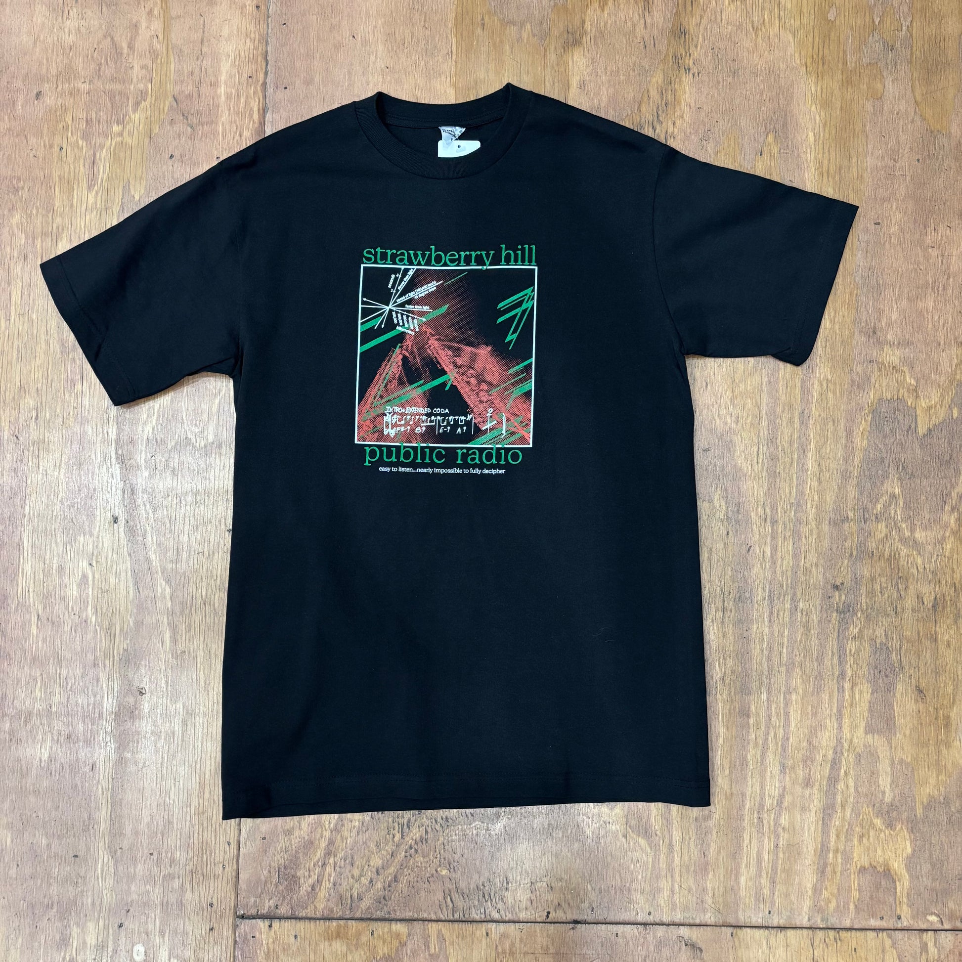 black t-shirt with STRAWBERRY HILL public radio graphic on center of chest