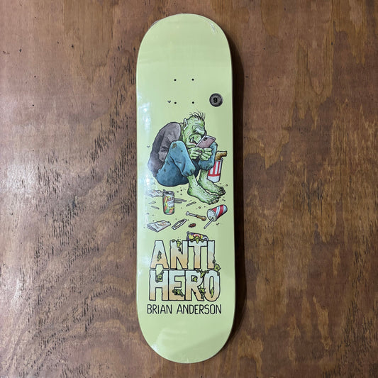 hand drawn troll logo of troll sitting on floor of room on skateboard deck