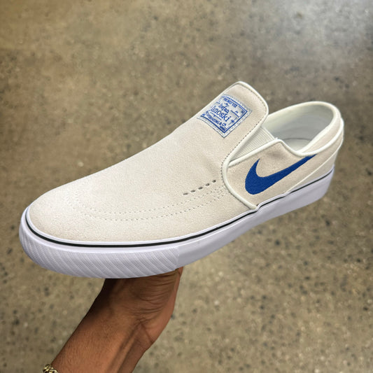 white suede shoe with blue logo