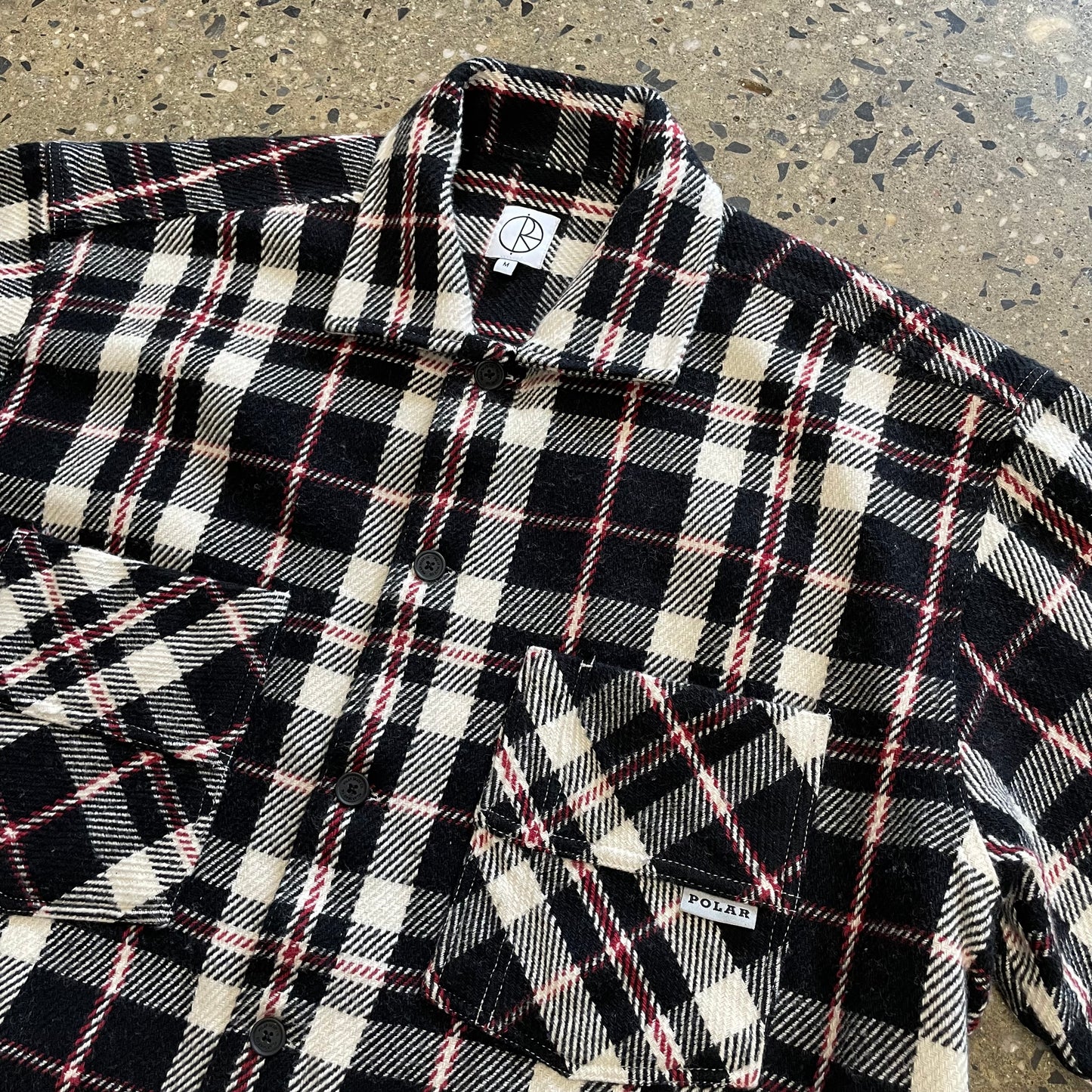 red, black, and white plaid, two pockets on front of shirt