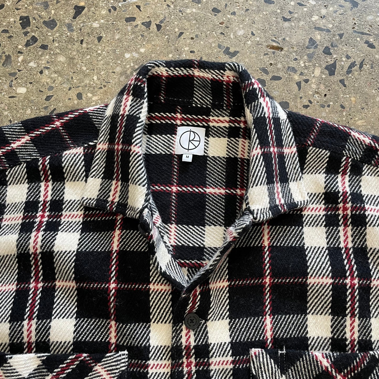 closeup of collar, red, black, and white plaid