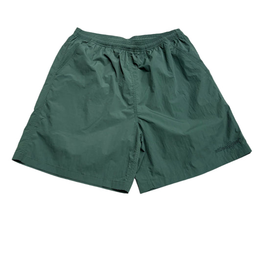 green nylon short with small tonal STUSSY embroidery on left leg
