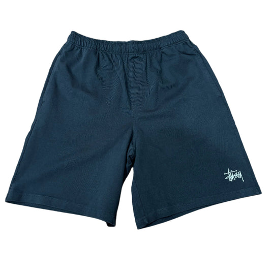 black cotton shorts with white STUSSY logo on left leg