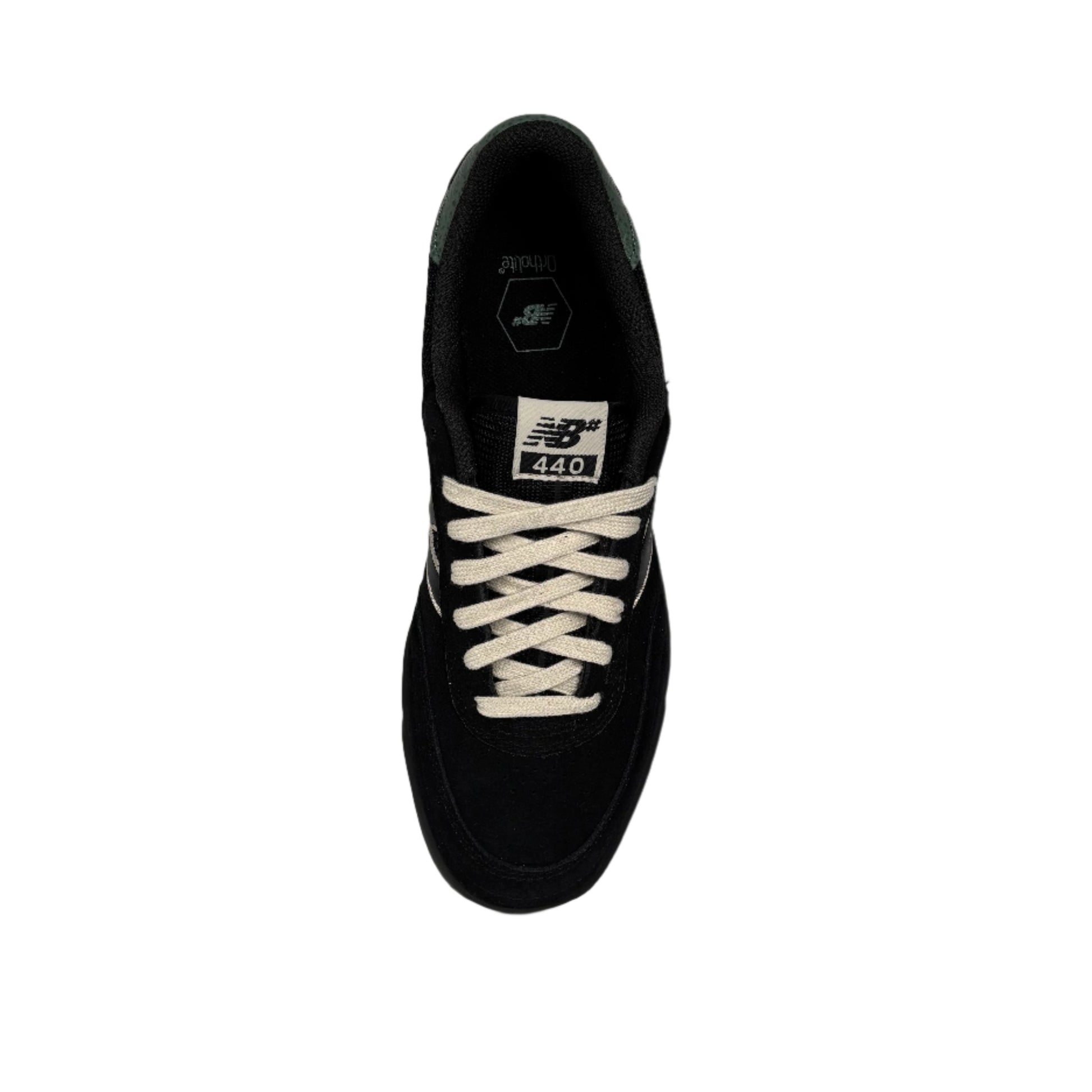 overhead view of black suede lowtop skate sneaker with off white laces