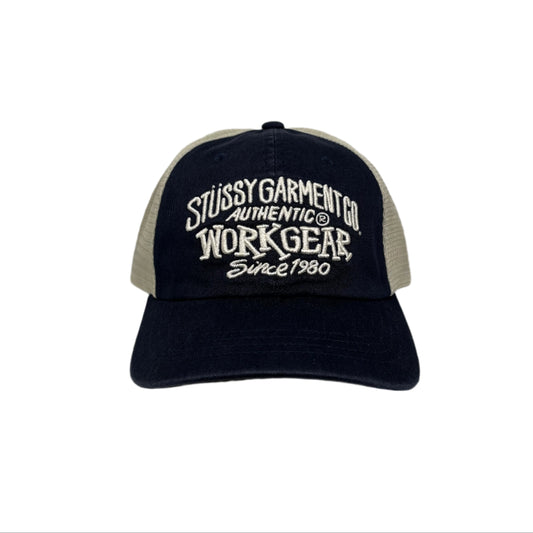 front view of mesh and cotton cap with STUSSY GARMENT CO AUTHENTIC WORKGEAR SINCE 1980 embroidered on crown of cap