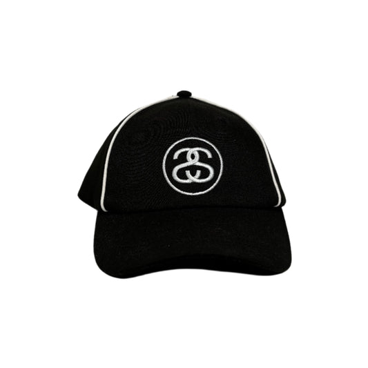 front view of S DOUBLE circle logo on black cap with white piping