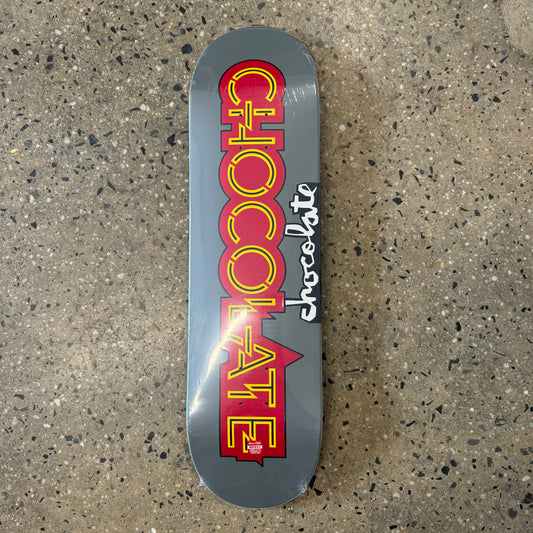 grey skate deck with red and yellow Chocolate logo