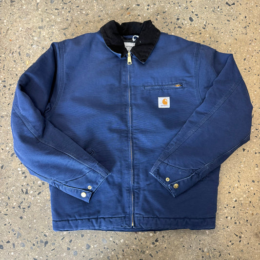 blue jacket with black corduroy collar