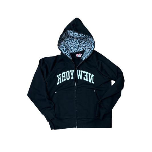 black hoodie with printed inside of hood and NEW YORK printed backwards, in an arch pattern
