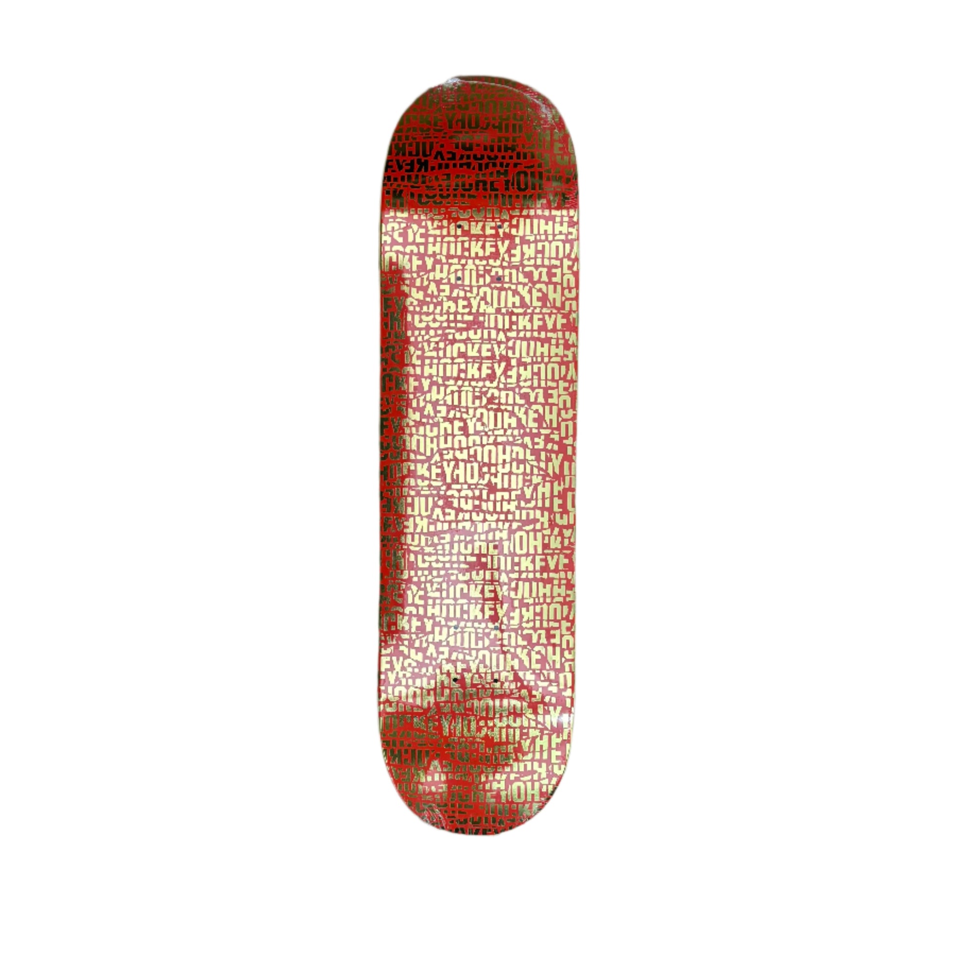 red and gold skateboard deck with repeating HOCKEY pattern on the deck