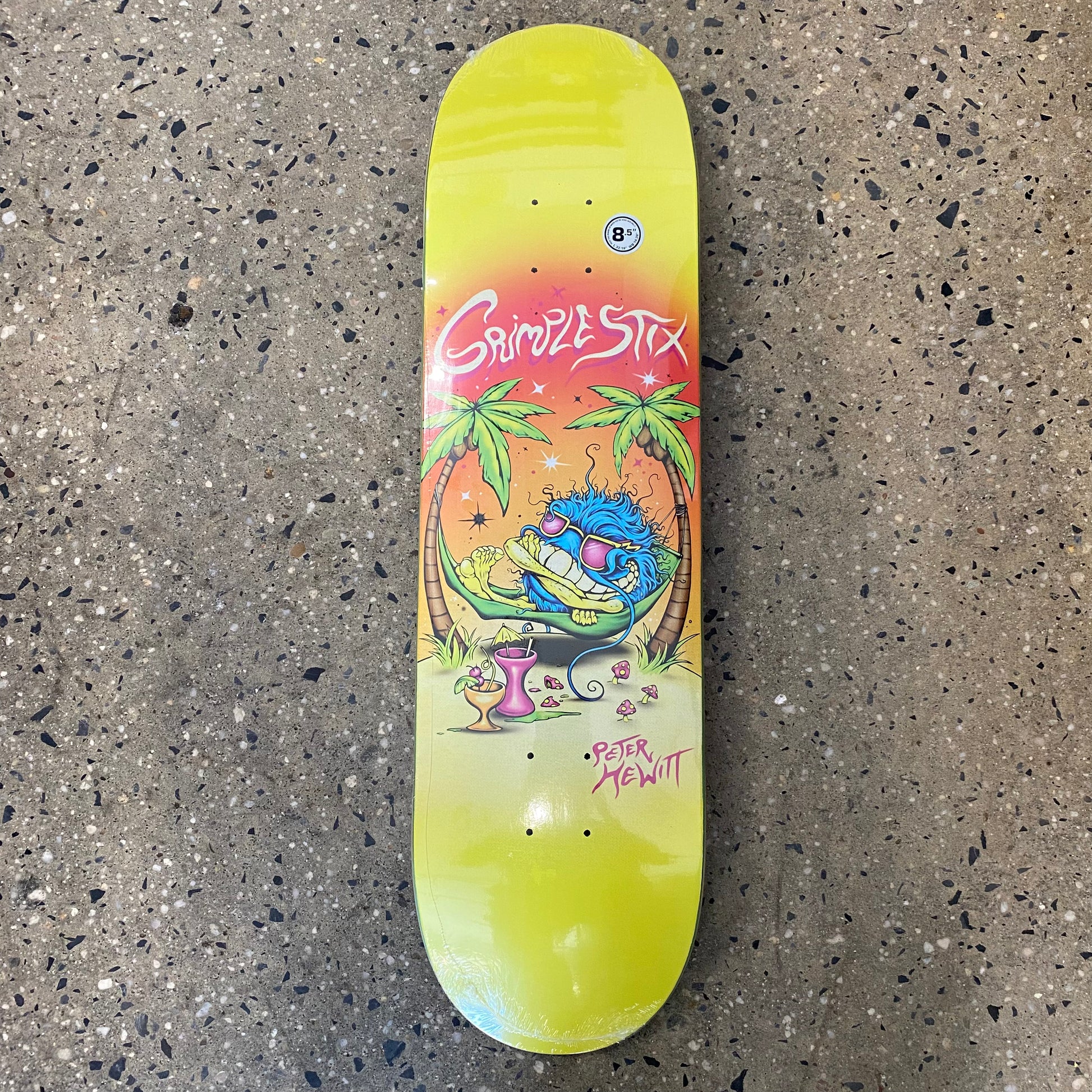 yellow skateboard with a creature relaxing in a hammock on a beach