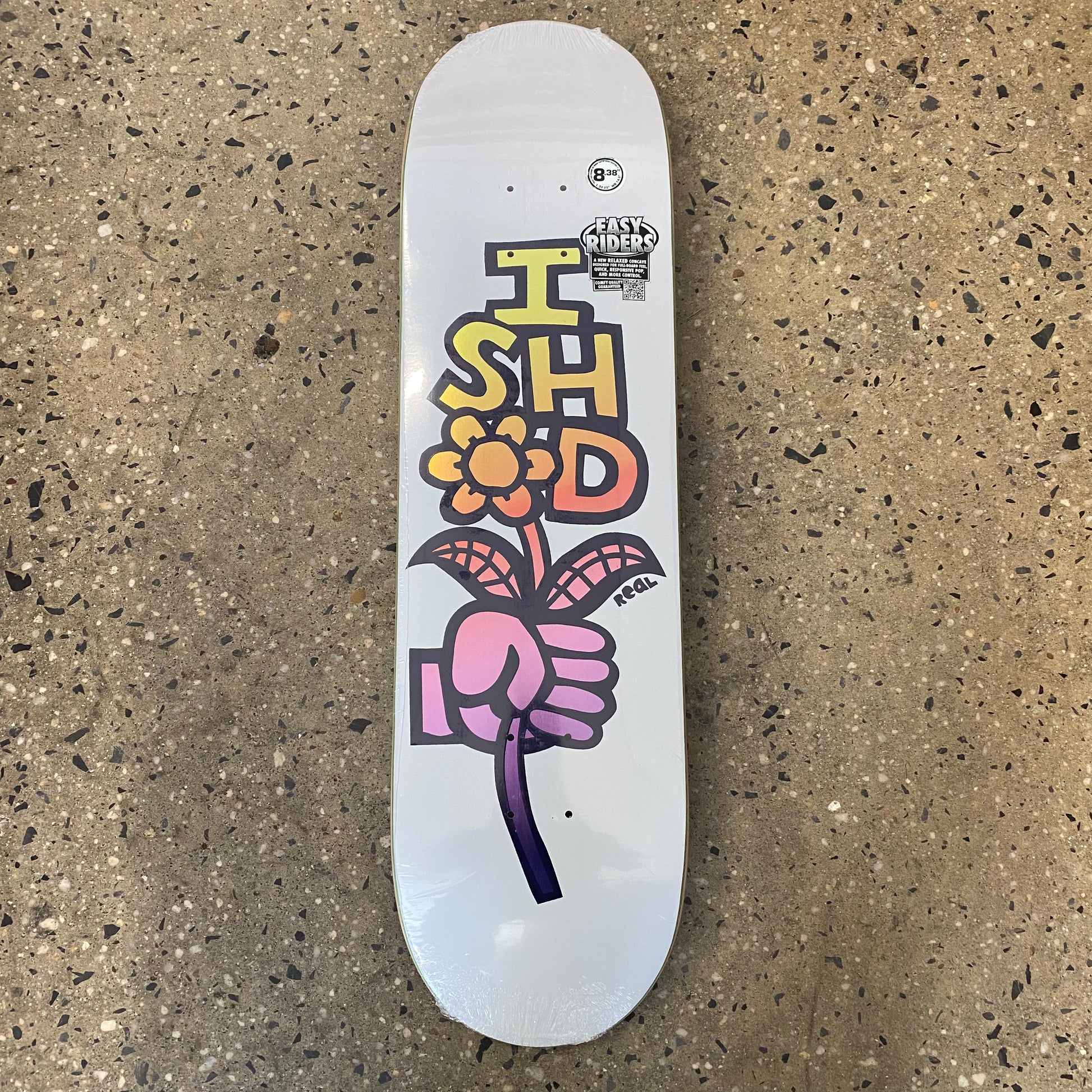 white skateboard with ishod written in a drawing of a hand holding a bouquet of flowers