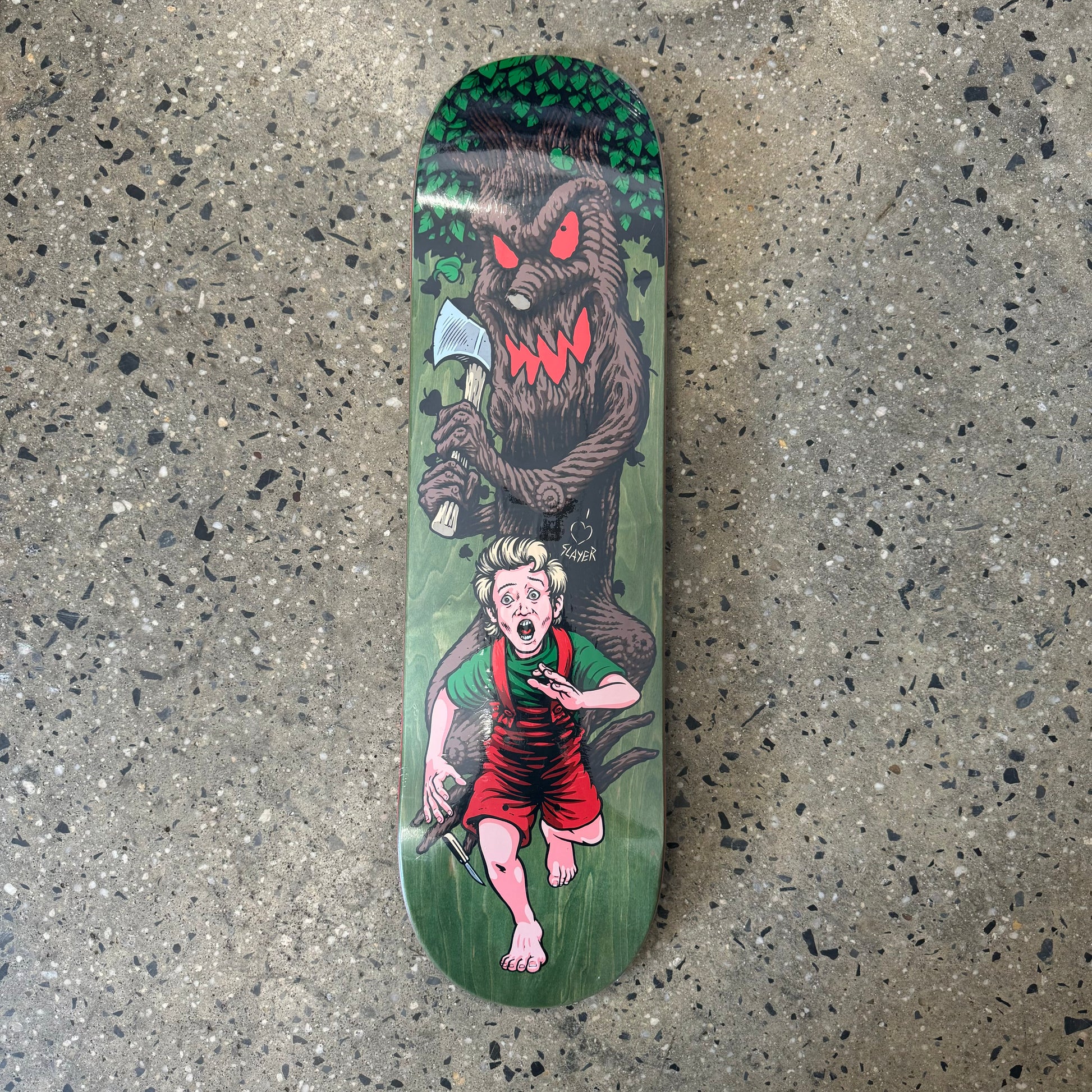 woodstained skateboard deck with an evil tree chasing a boy with an ax