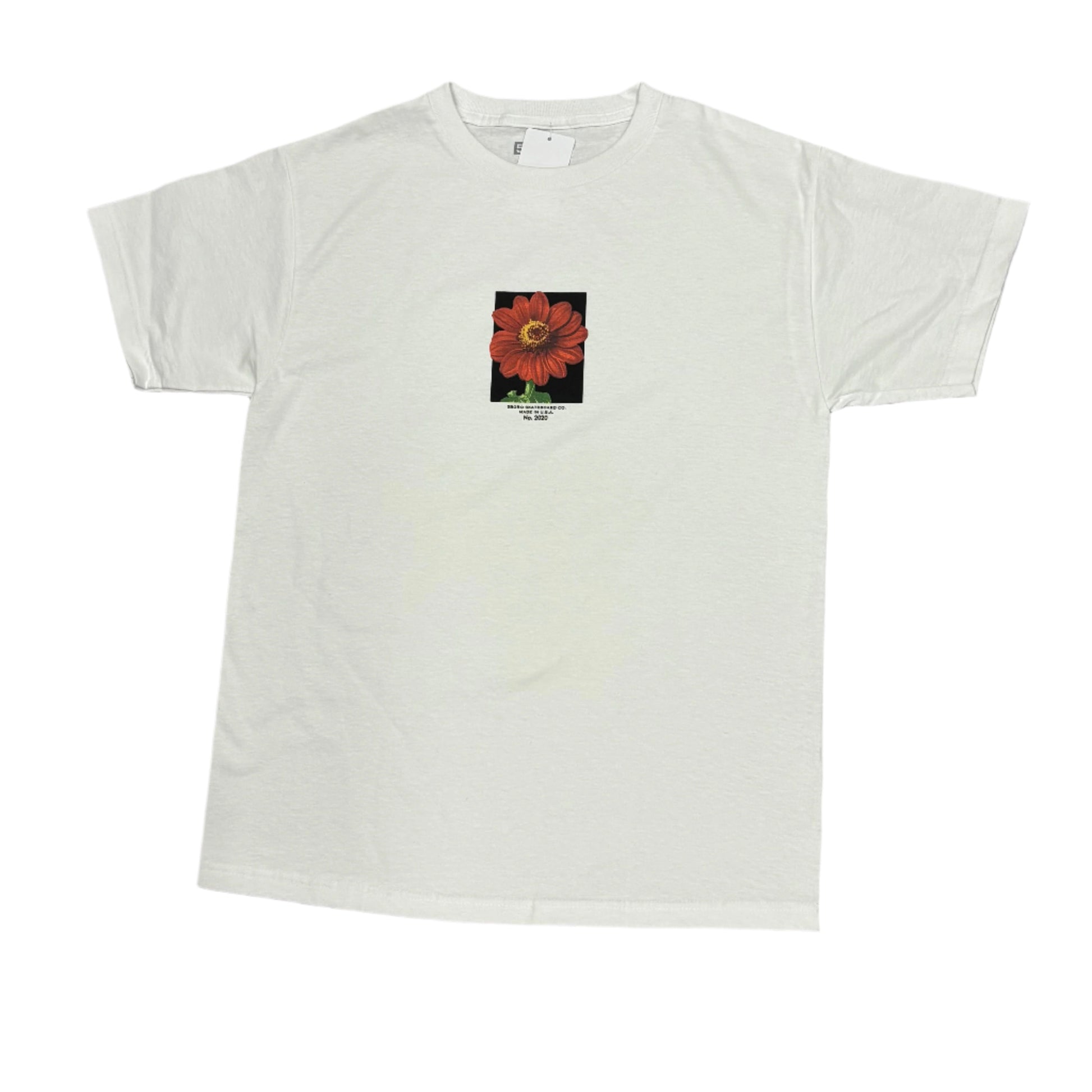White t-shirt with a small flower graphic on a white surface