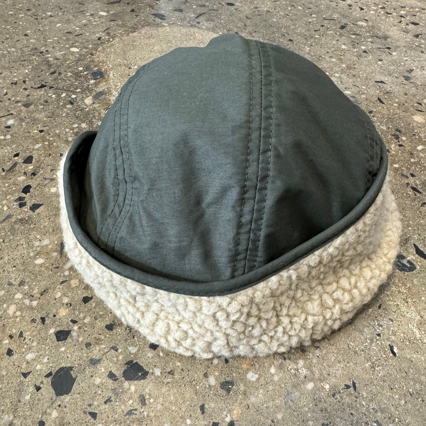 olive green cap with sherpa lined ear flaps