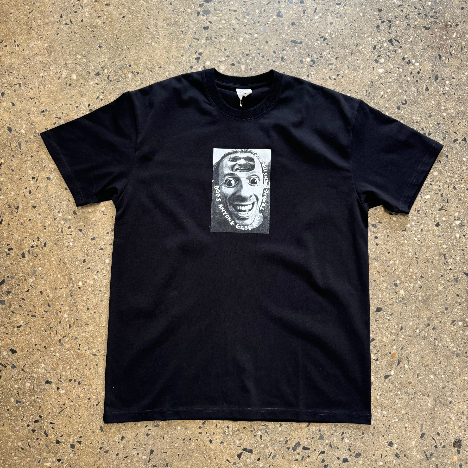 black t shirt with a photo of a scary looking man in the center