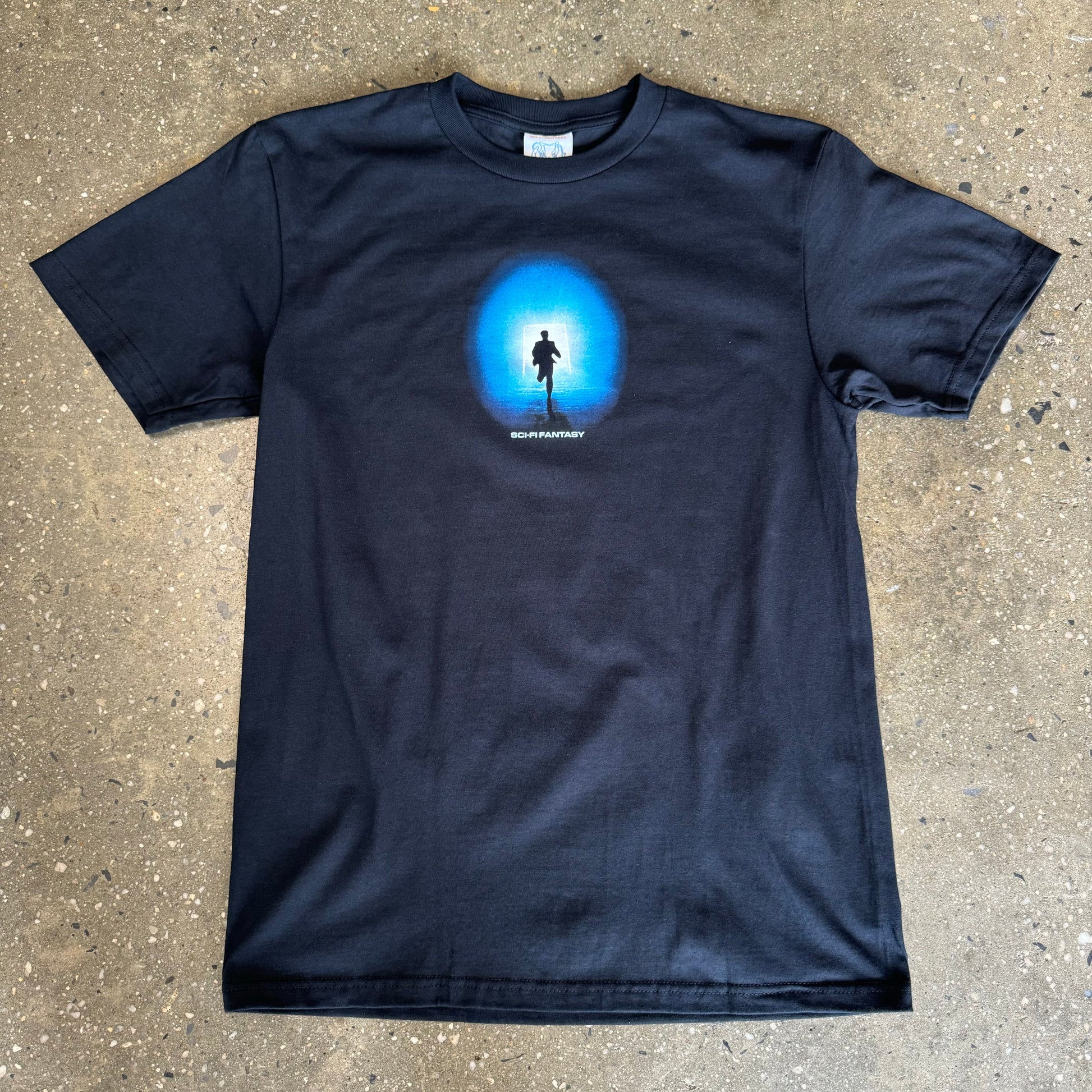 black t shirt with a man running towards a blue light