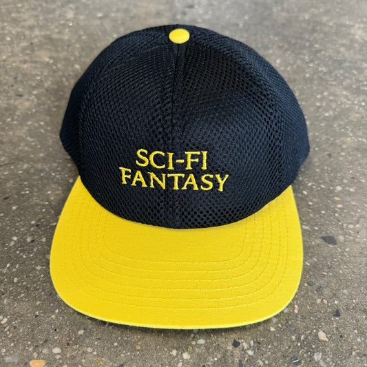 black mesh hat with yellow text and bill