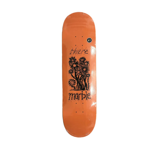Orange skateboard deck with black graphics on a white surface