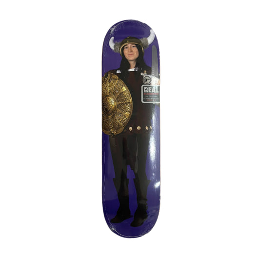 Skateboard deck with a purple background and a person wearing a uniform and gold belt.