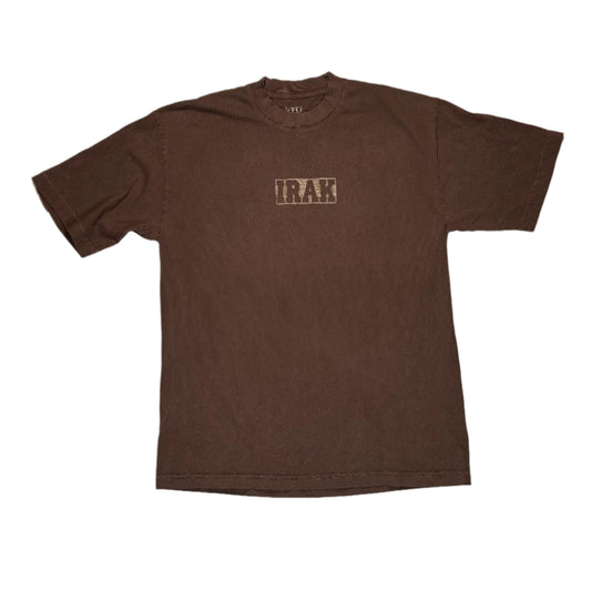 Brown t-shirt with 'IRAK' printed on it, laid flat on a white surface