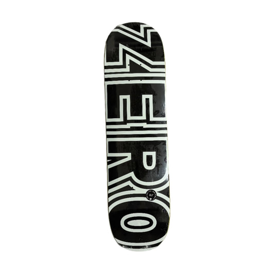 Black and white skateboard deck with 'ZERO' logo on a white surface