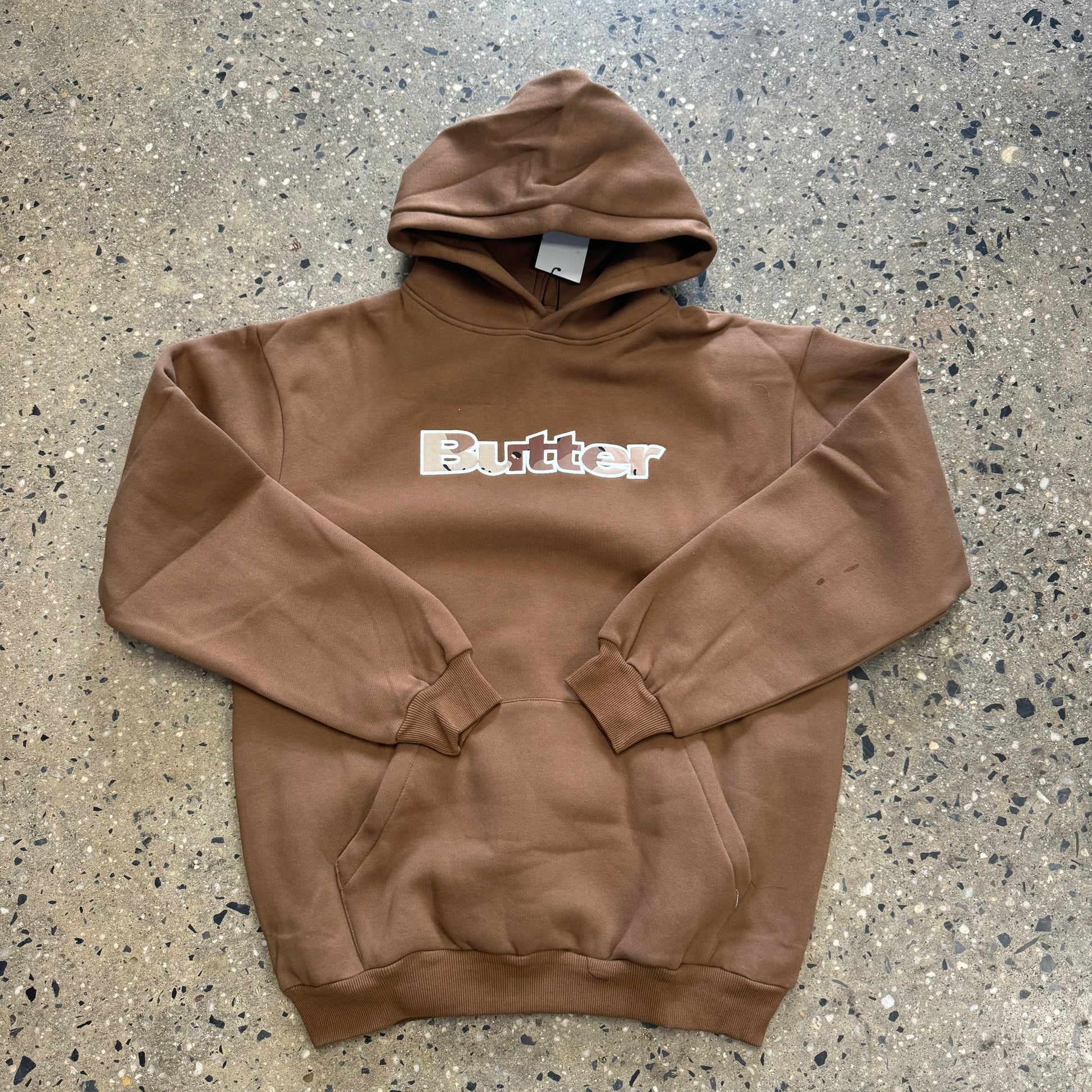 Front view of brown butter logo pullover hoodie