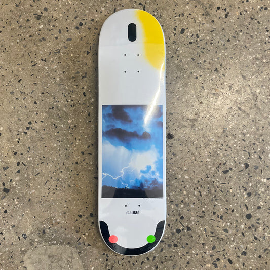 white skateboard deck with yellow and black accents with a photo of the sky in the center