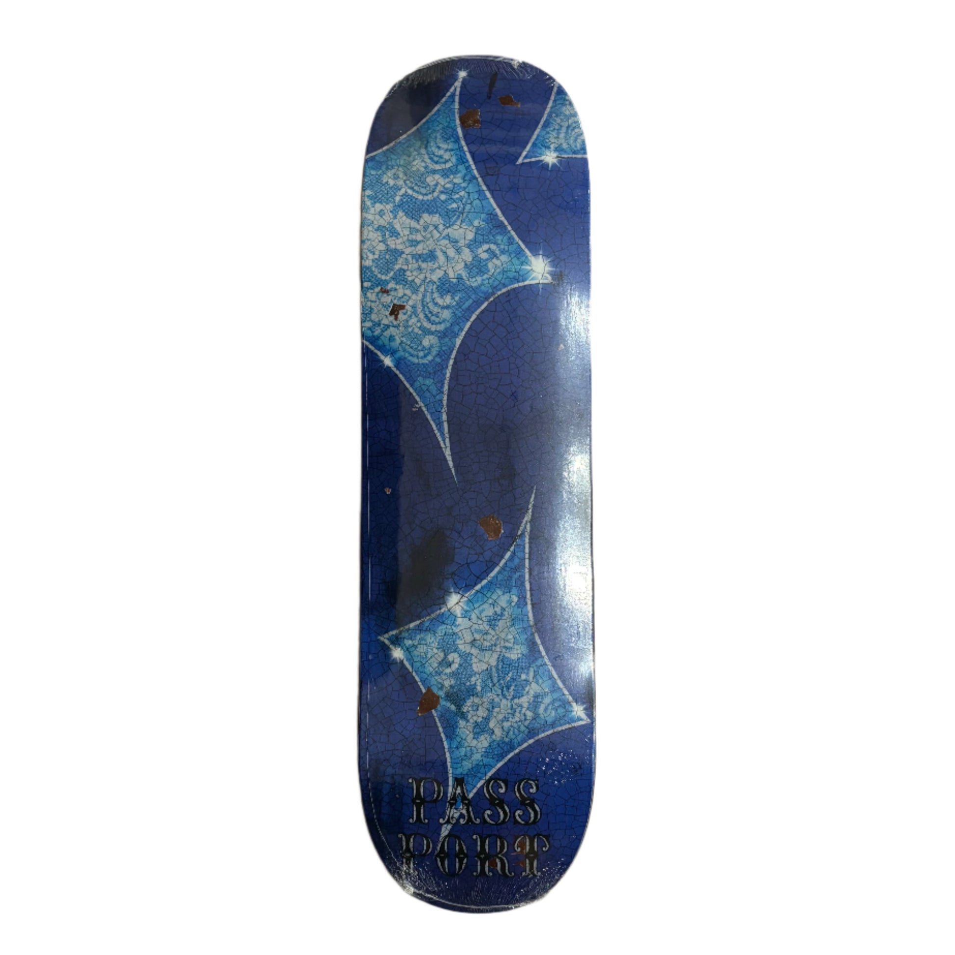 Blue and white patterned skateboard deck on a white surface