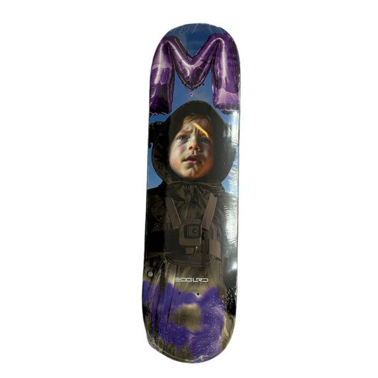 Skateboard deck with a graphic of a child and purple 'M' on a white surface