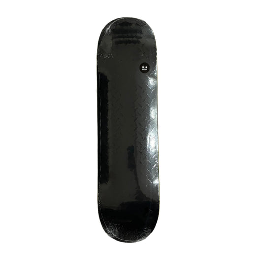Black diamond plate pattern skateboard deck on a white surface