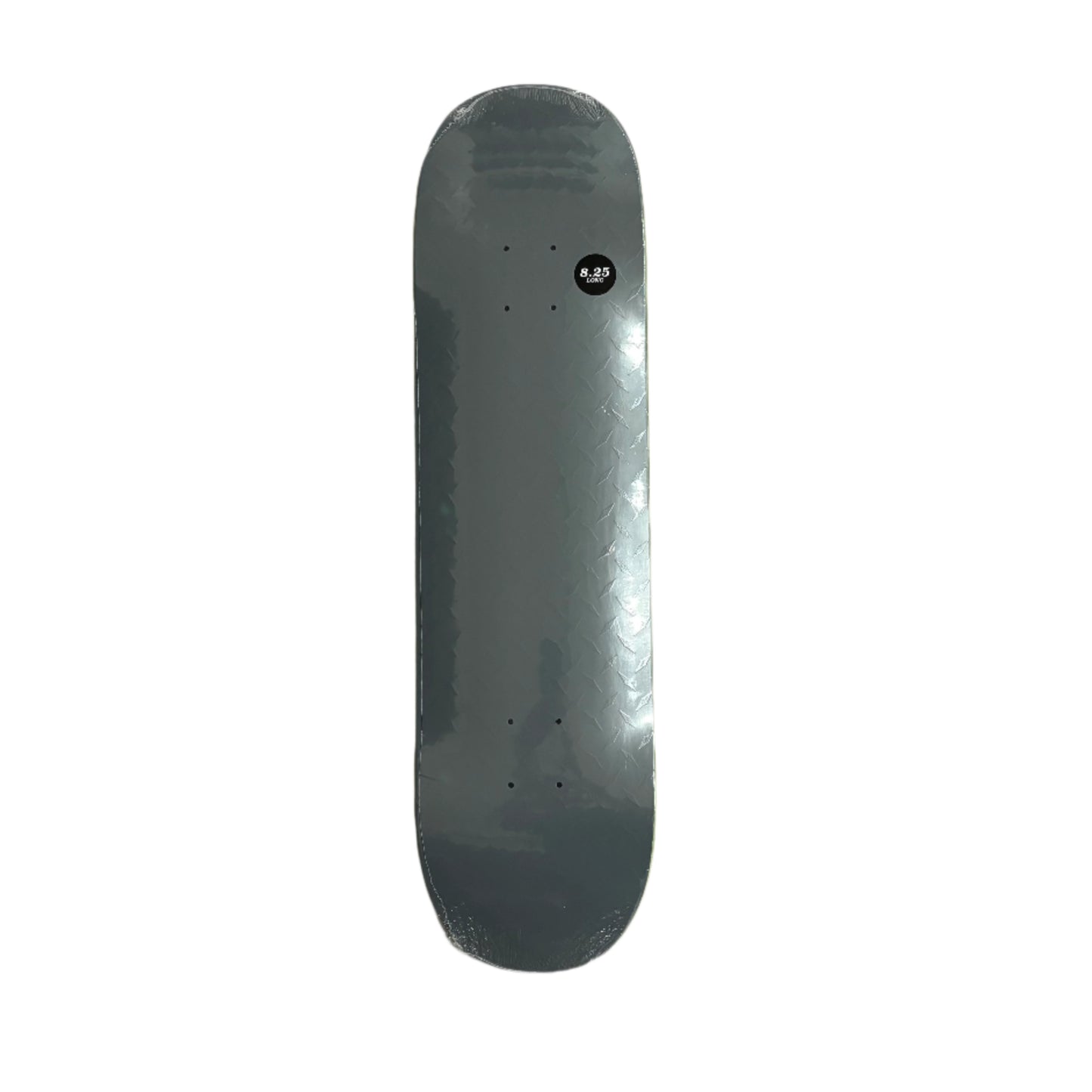 Gray skateboard deck on a textured surface with wooden sides.