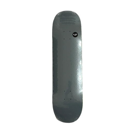 Gray skateboard deck on a textured surface with wooden sides.
