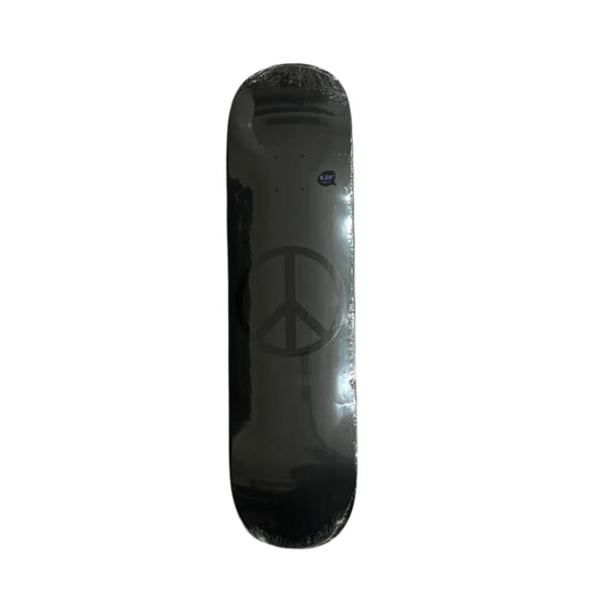 Black skateboard deck with peace symbol on a white background