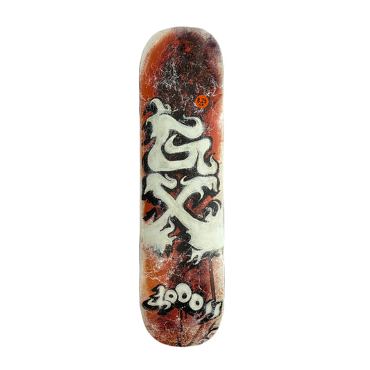 Skateboard deck with white and black design on a white background